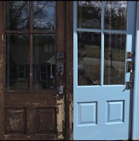 a blue front door with a wooden frame